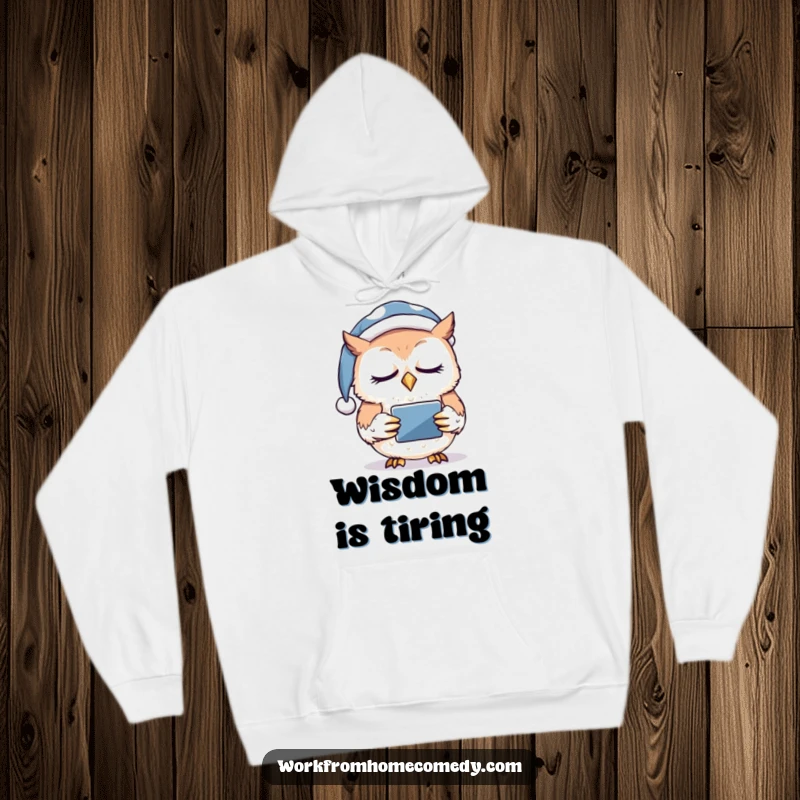 Funny owl wearing a nightcap, nodding off while clutching a tablet on a cozy hoodie, perfect for late-night browsing.